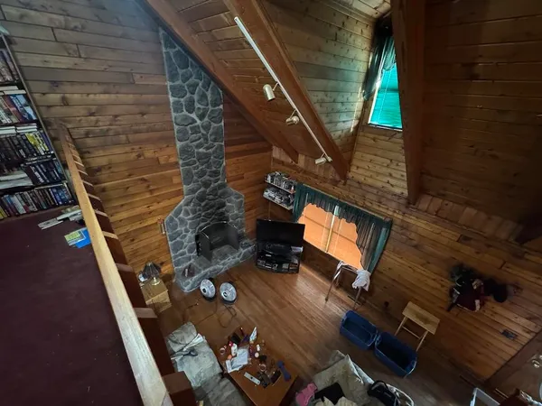 a living room with couch next to a window