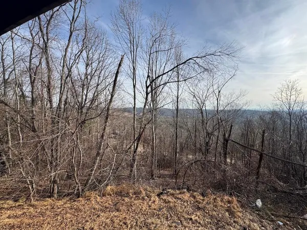 a view of a balcony with furniture