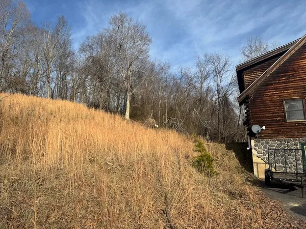 a view of large house with a yard