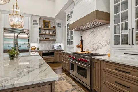 a bedroom with a bed and a flat tv screen on dresser