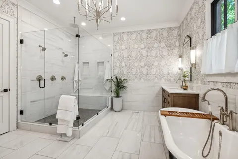 a bathroom with a toilet sink vanity and mirror