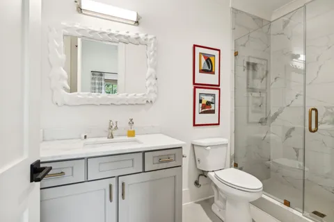 a view of green field with trees in the background