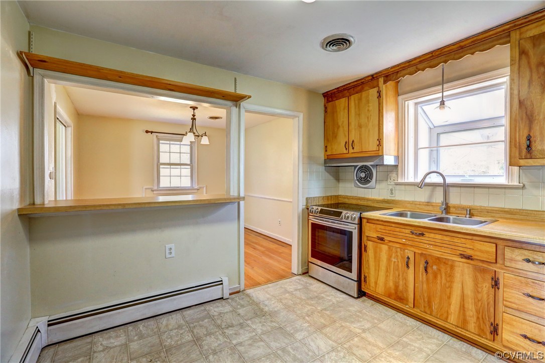 8207 Colebrook Road Richmond, VA 23227 - Photo 11 of 35 a kitchen with stainless steel appliances granite countertop a stove sink and cabinets
