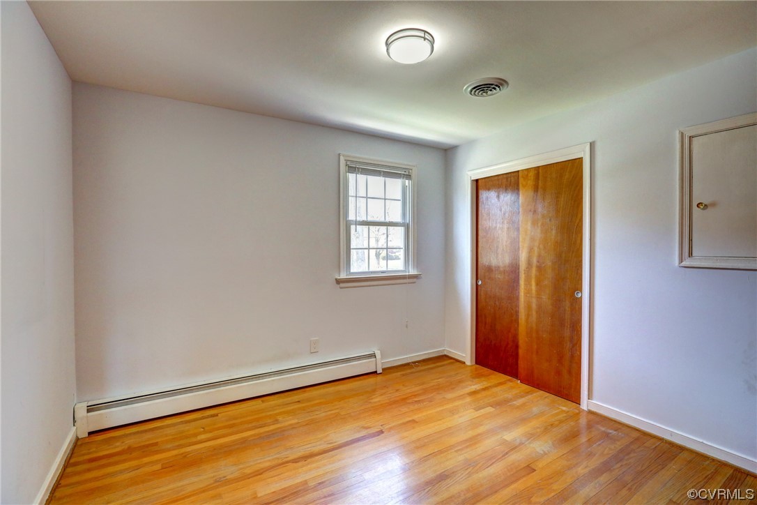 8207 Colebrook Road Richmond, VA 23227 - Photo 13 of 35 an empty room with wooden floor and windows