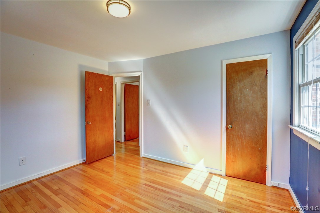 8207 Colebrook Road Richmond, VA 23227 - Photo 16 of 35 an empty room with wooden floor and windows