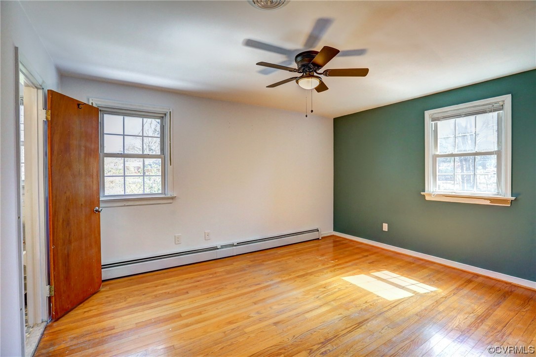 8207 Colebrook Road Richmond, VA 23227 - Photo 17 of 35 a view of empty room with wooden floor and fan