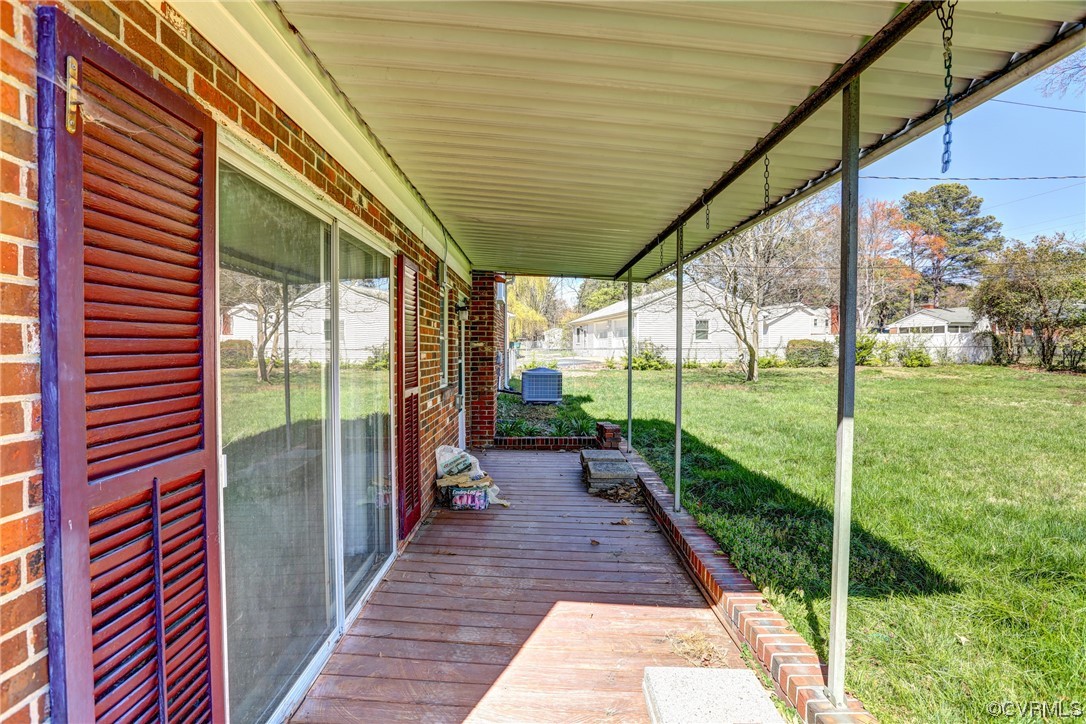 8207 Colebrook Road Richmond, VA 23227 - Photo 31 of 35 a view of a porch with chairs and backyard