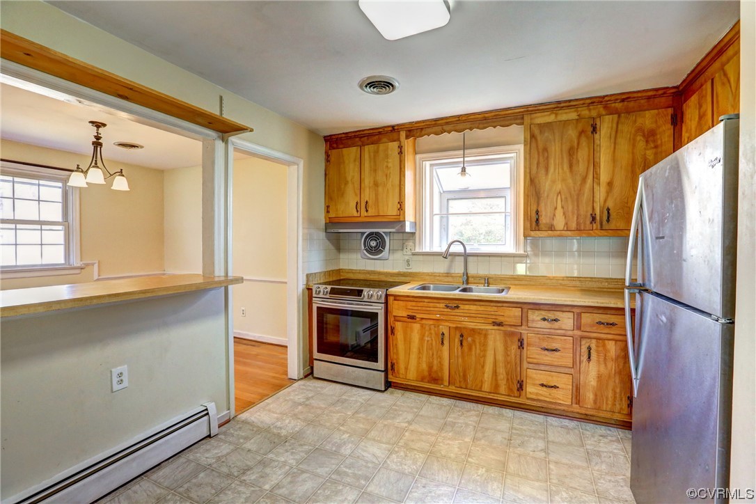 8207 Colebrook Road Richmond, VA 23227 - Photo 10 of 35 a kitchen with stainless steel appliances granite countertop a refrigerator and a sink