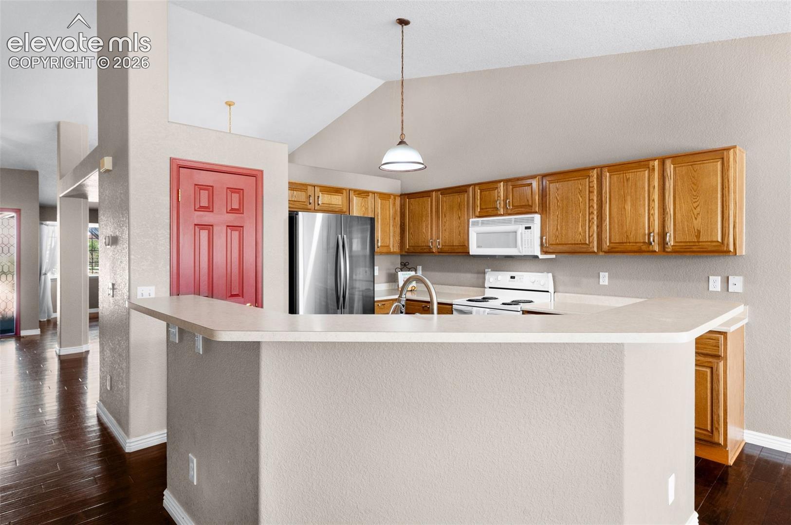 7840 Midnight Road Peyton, CO 80831 - Photo 20 of 48 Conversations are made easy from this breakfast bar. Pull up a stool!