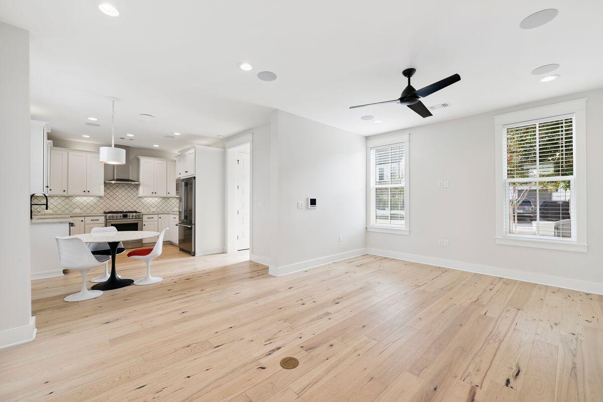 414 Ridgewalk Circle Santa Rosa Beach, FL 32459 - Photo 11 of 47 a view of kitchen with stainless steel appliances refrigerator oven dining table and chairs