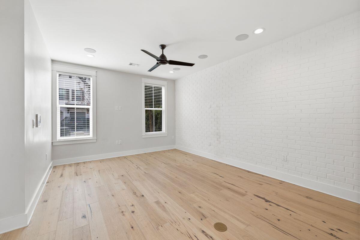 414 Ridgewalk Circle Santa Rosa Beach, FL 32459 - Photo 12 of 47 wooden floor in an empty room with a window