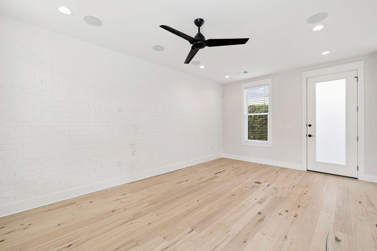 414 Ridgewalk Circle Santa Rosa Beach, FL 32459 - Photo 14 of 47 a view of a livingroom with a hardwood floor and a ceiling fan