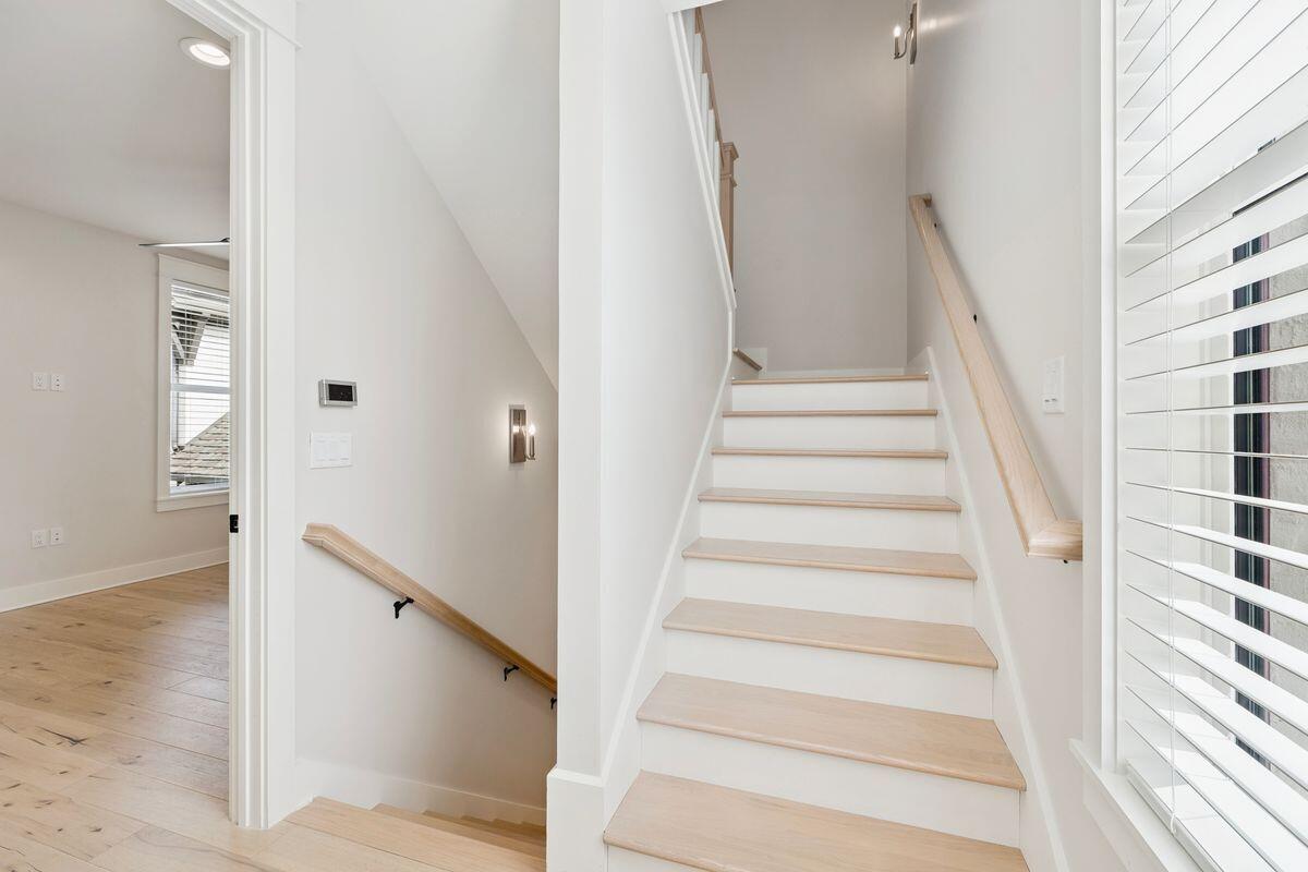 414 Ridgewalk Circle Santa Rosa Beach, FL 32459 - Photo 18 of 47 a view of staircase with white walls and windows
