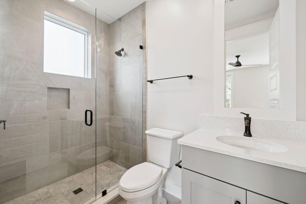 414 Ridgewalk Circle Santa Rosa Beach, FL 32459 - Photo 27 of 47 a bathroom with a sink a toilet and shower