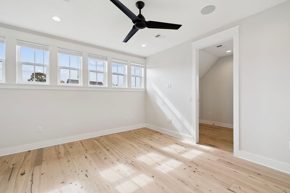 414 Ridgewalk Circle Santa Rosa Beach, FL 32459 - Photo 34 of 47 an empty room with wooden floor and windows