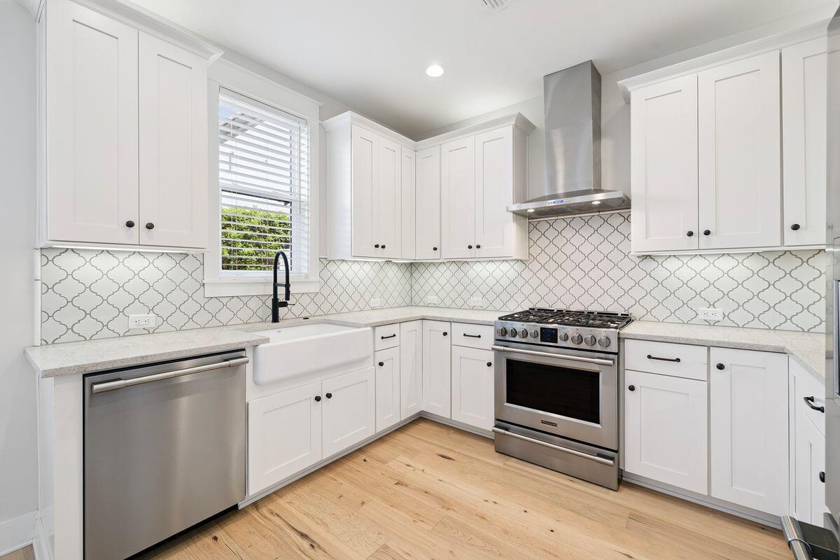 414 Ridgewalk Circle Santa Rosa Beach, FL 32459 - Photo 5 of 47 a kitchen with white cabinets and white appliances