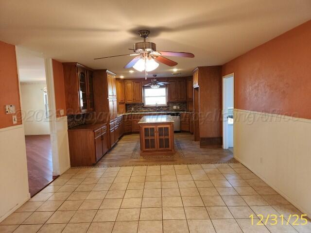 3401 Sunlite Street Amarillo, TX 79109 - Photo 11 of 26 a kitchen with stainless steel appliances granite countertop a refrigerator and a sink