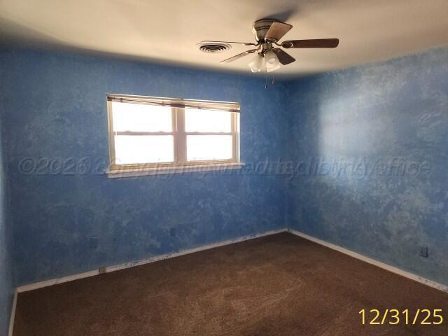 3401 Sunlite Street Amarillo, TX 79109 - Photo 15 of 26 an empty room with a window and a fan
