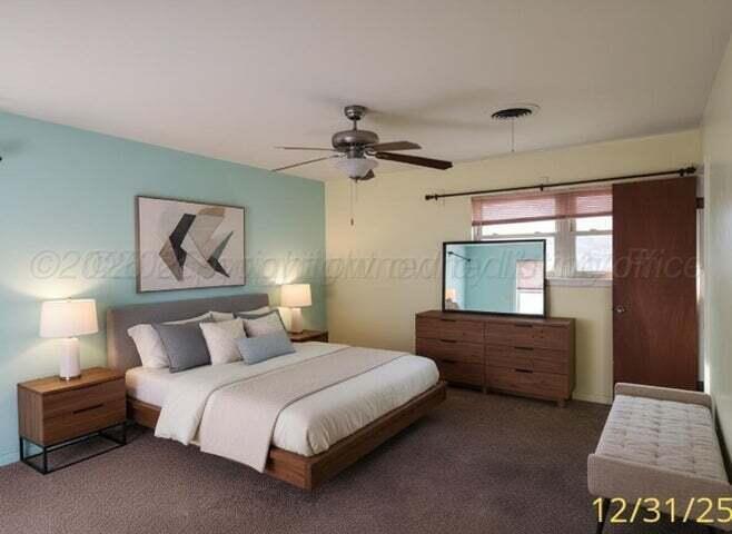 3401 Sunlite Street Amarillo, TX 79109 - Photo 19 of 26 a bedroom with a bed and a chandelier