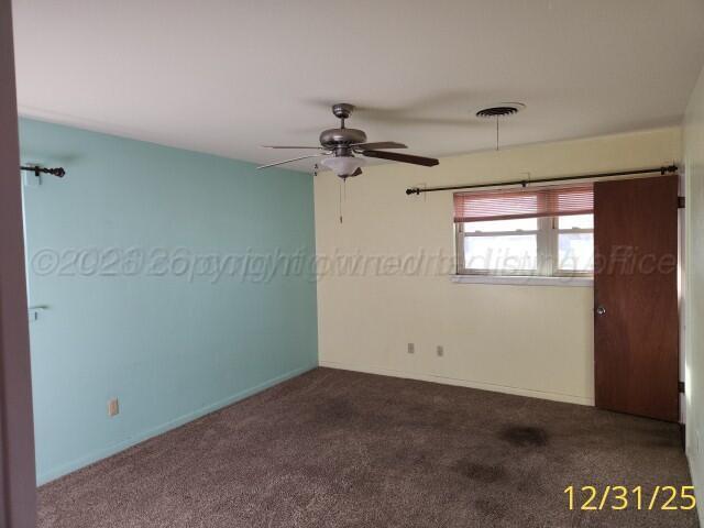 3401 Sunlite Street Amarillo, TX 79109 - Photo 20 of 26 an empty room with windows and fan