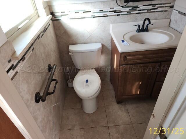 3401 Sunlite Street Amarillo, TX 79109 - Photo 21 of 26 a bathroom with a sink and a toilet