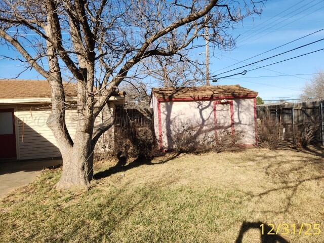 3401 Sunlite Street Amarillo, TX 79109 - Photo 25 of 26 a view of a yard covered with snow in the yard