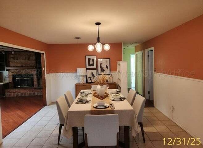 3401 Sunlite Street Amarillo, TX 79109 - Photo 5 of 26 a dining room with furniture and window