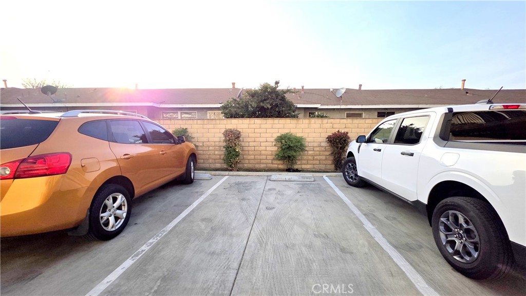 7331 9th Street, Unit 2 Buena Park, CA 90621 - Photo 18 of 19 a view of cars parked in a parking lot