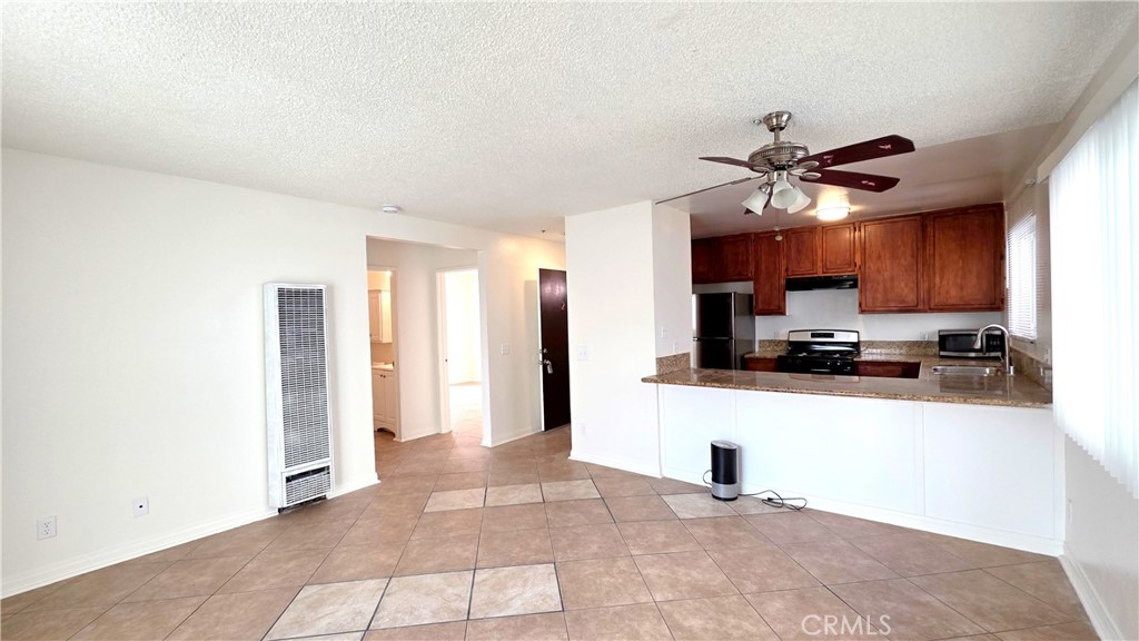7331 9th Street, Unit 2 Buena Park, CA 90621 - Photo 3 of 19 a view of a kitchen with a sink and a window