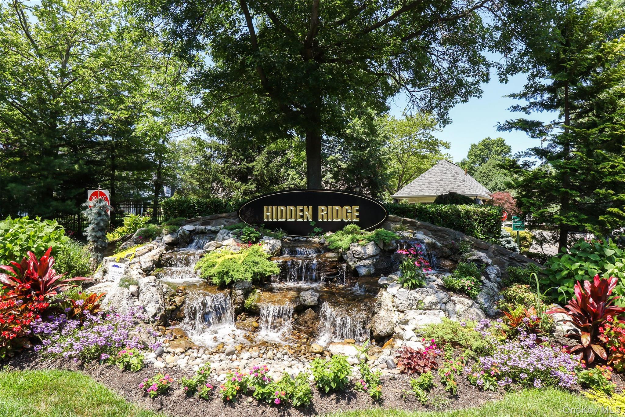 44 Hidden Ridge Drive Syosset, NY 11791 - Photo 27 of 28 a view of a garden with a bench