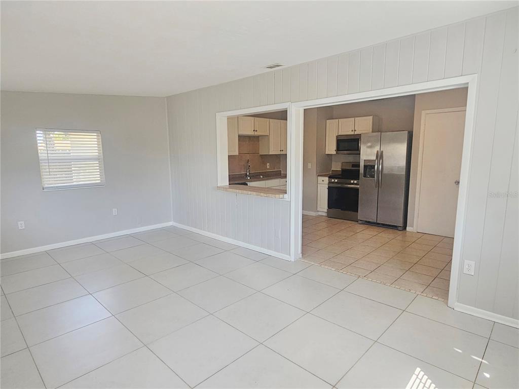 7000 Brentford Road Sarasota, FL 34241 - Photo 10 of 29 a view of a kitchen with a sink and refrigerator