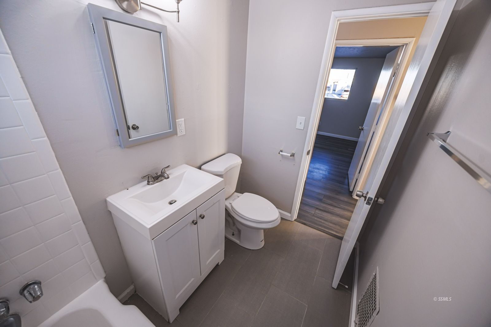 1525 South Porter Ridgecrest, CA 93555 - Photo 18 of 29 a bathroom with a toilet a sink and a mirror