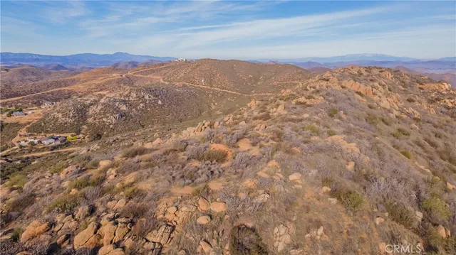 a view of a mountain range in a cloudy sky