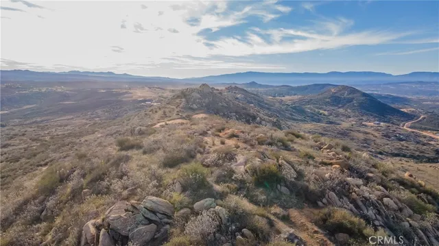 an aerial view of houses covered in trees