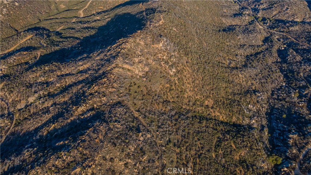 0 Lawghlin Road Hemet, CA 92543 - Photo 8 of 19 a view of a yard with a tree