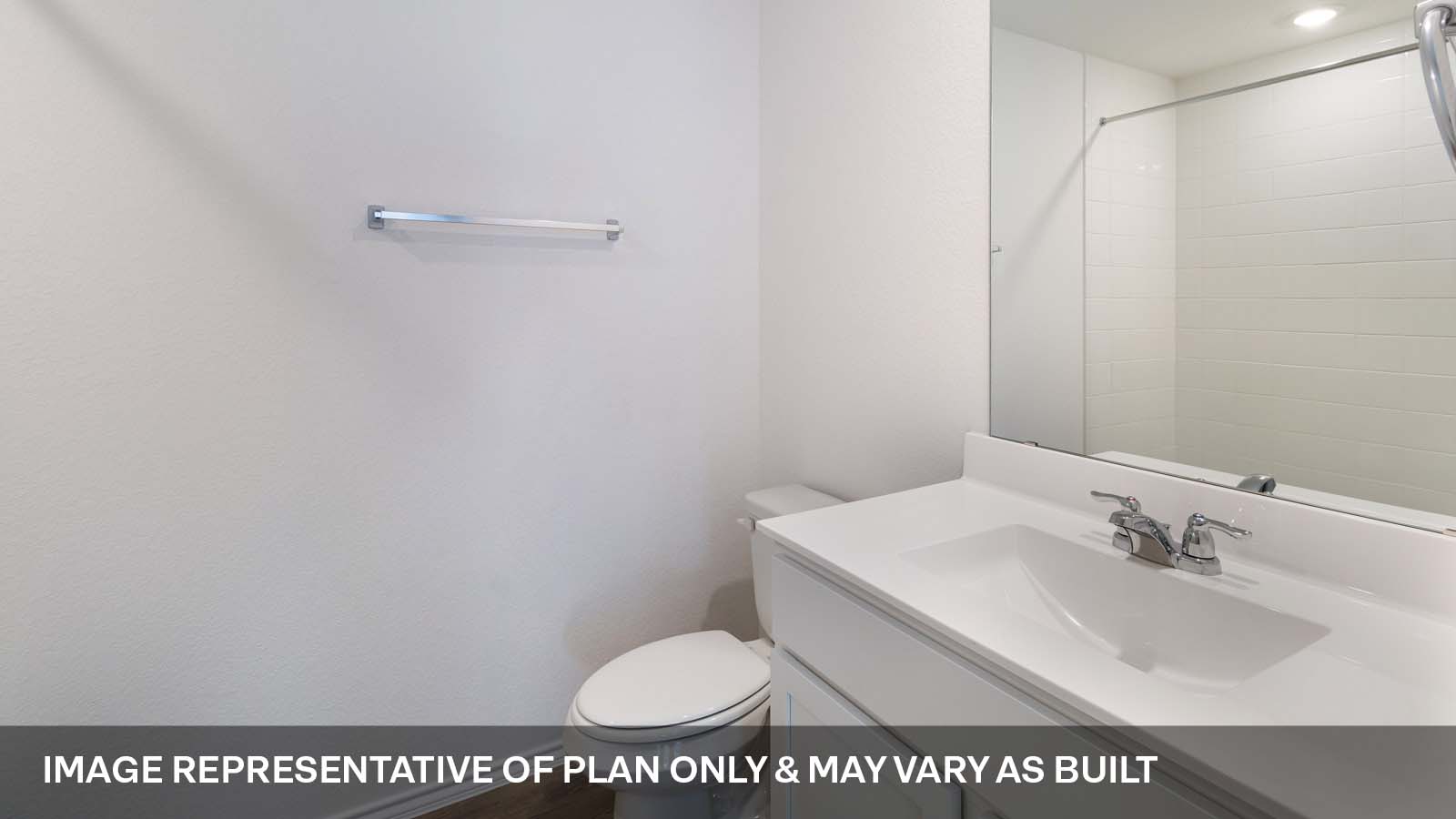 1173 Celosia Loop Kyle, TX 78640 - Photo 14 of 15 a bathroom with a sink a toilet and a mirror