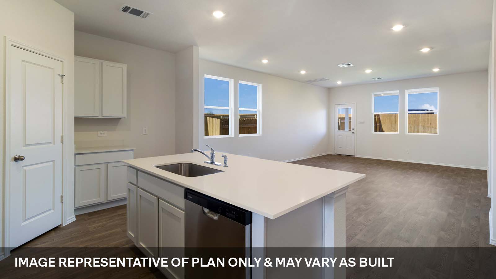 1173 Celosia Loop Kyle, TX 78640 - Photo 4 of 15 a kitchen with a sink window and cabinets