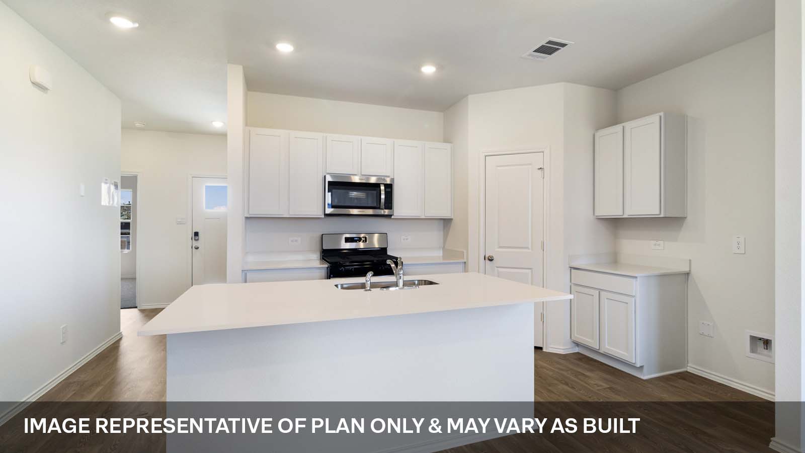 1173 Celosia Loop Kyle, TX 78640 - Photo 5 of 15 a kitchen with kitchen island a white counter top space cabinets and stainless steel appliances