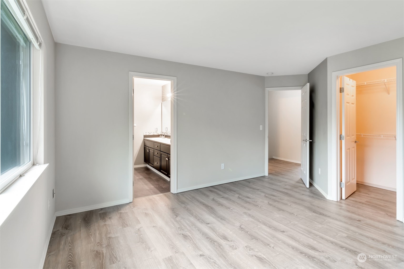 13197 Icicle Ridge Road Southeast Monroe, WA 98272 - Photo 12 of 25 an empty room with wooden floor and a window