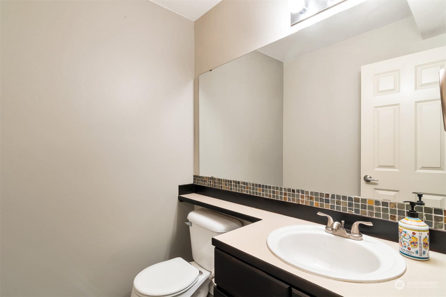 13197 Icicle Ridge Road Southeast Monroe, WA 98272 - Photo 9 of 25 a bathroom with a sink and a mirror