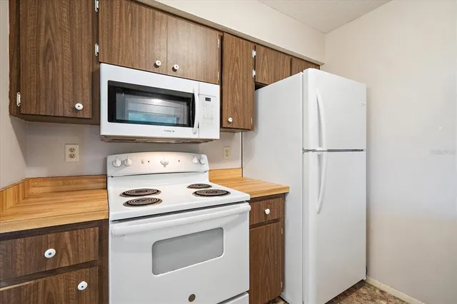 a kitchen with a stove and a microwave