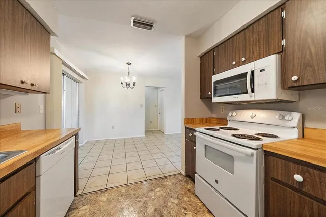 a kitchen with a stove and a microwave