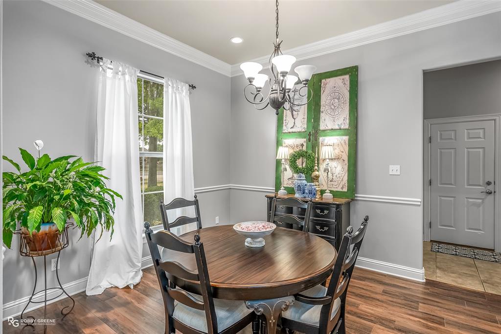 425 Kingston Road Benton, LA 71006 - Photo 11 of 35 a view of a dining room with furniture window and wooden floor