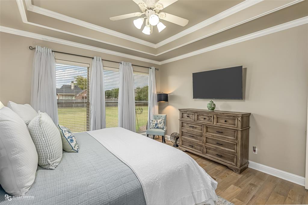 425 Kingston Road Benton, LA 71006 - Photo 18 of 35 a bedroom with a bed and a flat screen tv