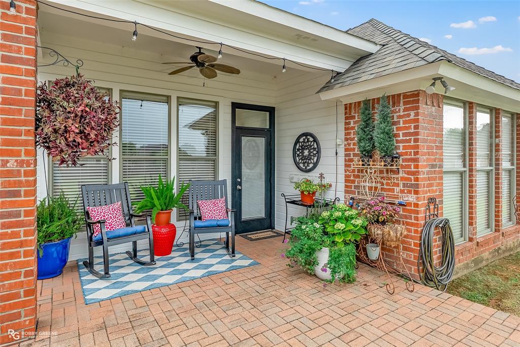 425 Kingston Road Benton, LA 71006 - Photo 27 of 35 a front view of a house with outdoor seating and plants
