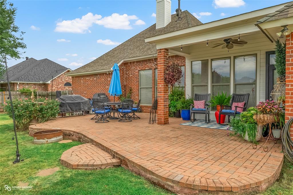 425 Kingston Road Benton, LA 71006 - Photo 28 of 35 a view of a house with backyard porch and sitting area