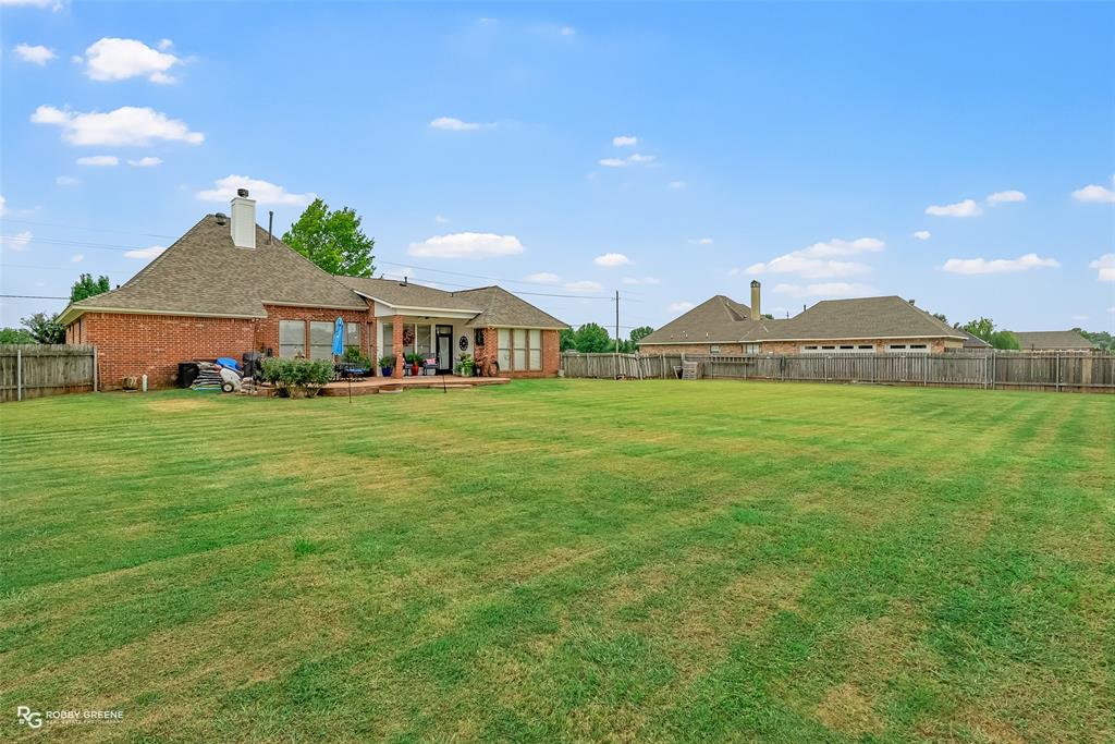 425 Kingston Road Benton, LA 71006 - Photo 34 of 35 a view of a house with a yard and sitting area