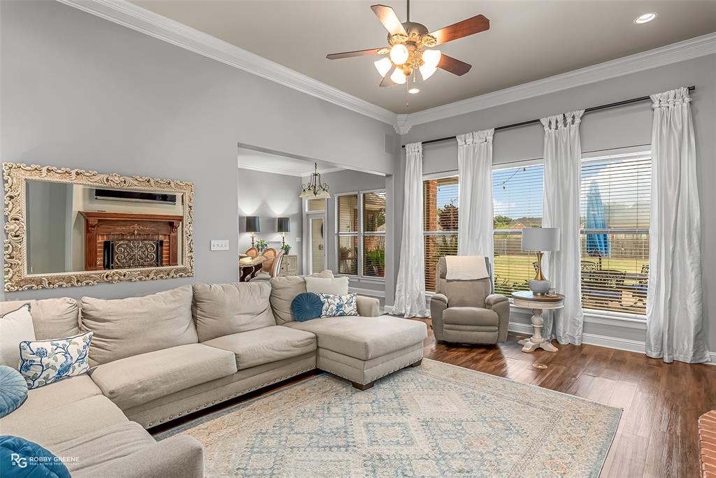 425 Kingston Road Benton, LA 71006 - Photo 5 of 35 a living room with furniture and a fireplace