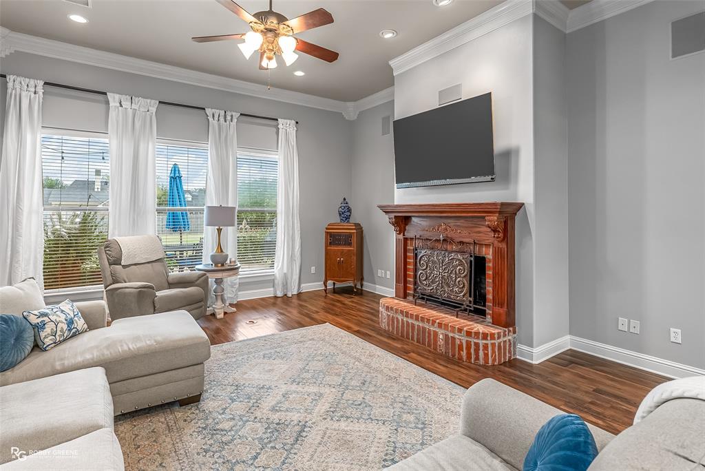 425 Kingston Road Benton, LA 71006 - Photo 9 of 35 a living room with furniture and a fireplace