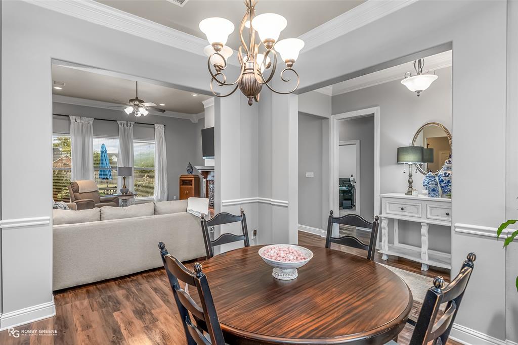 425 Kingston Road Benton, LA 71006 - Photo 10 of 35 a view of a dining room with furniture and wooden floor